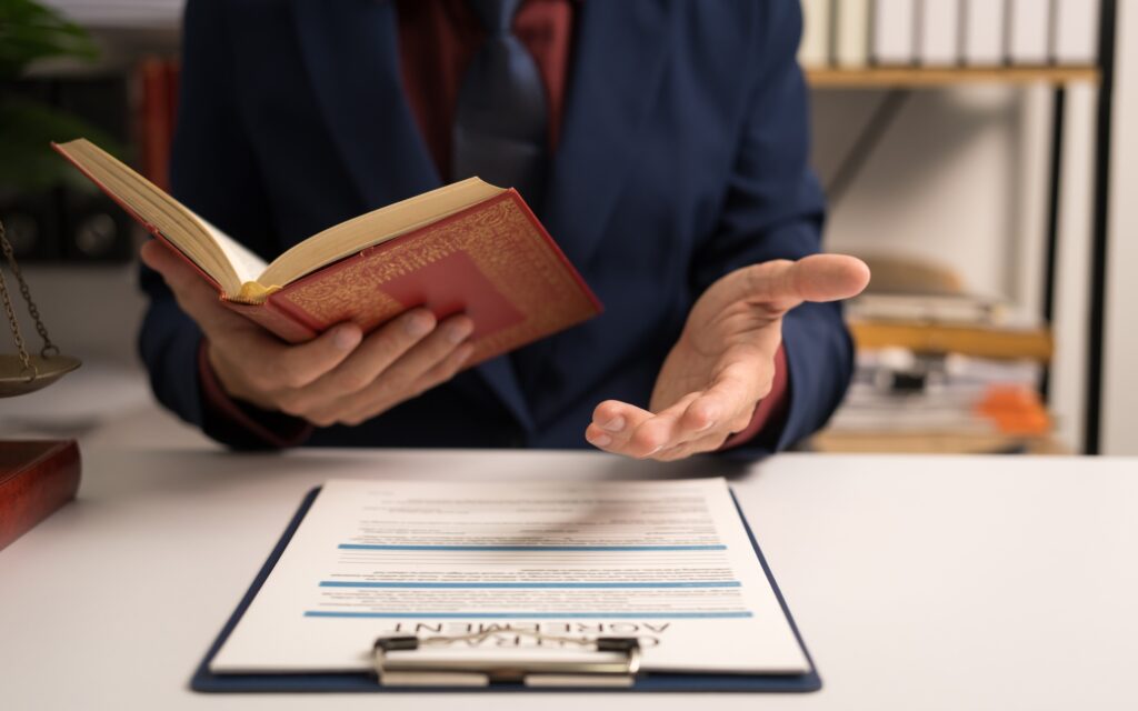 Male lawyer working with book, legal binding, Unilateral contract, Multilateral, Default, Obligation