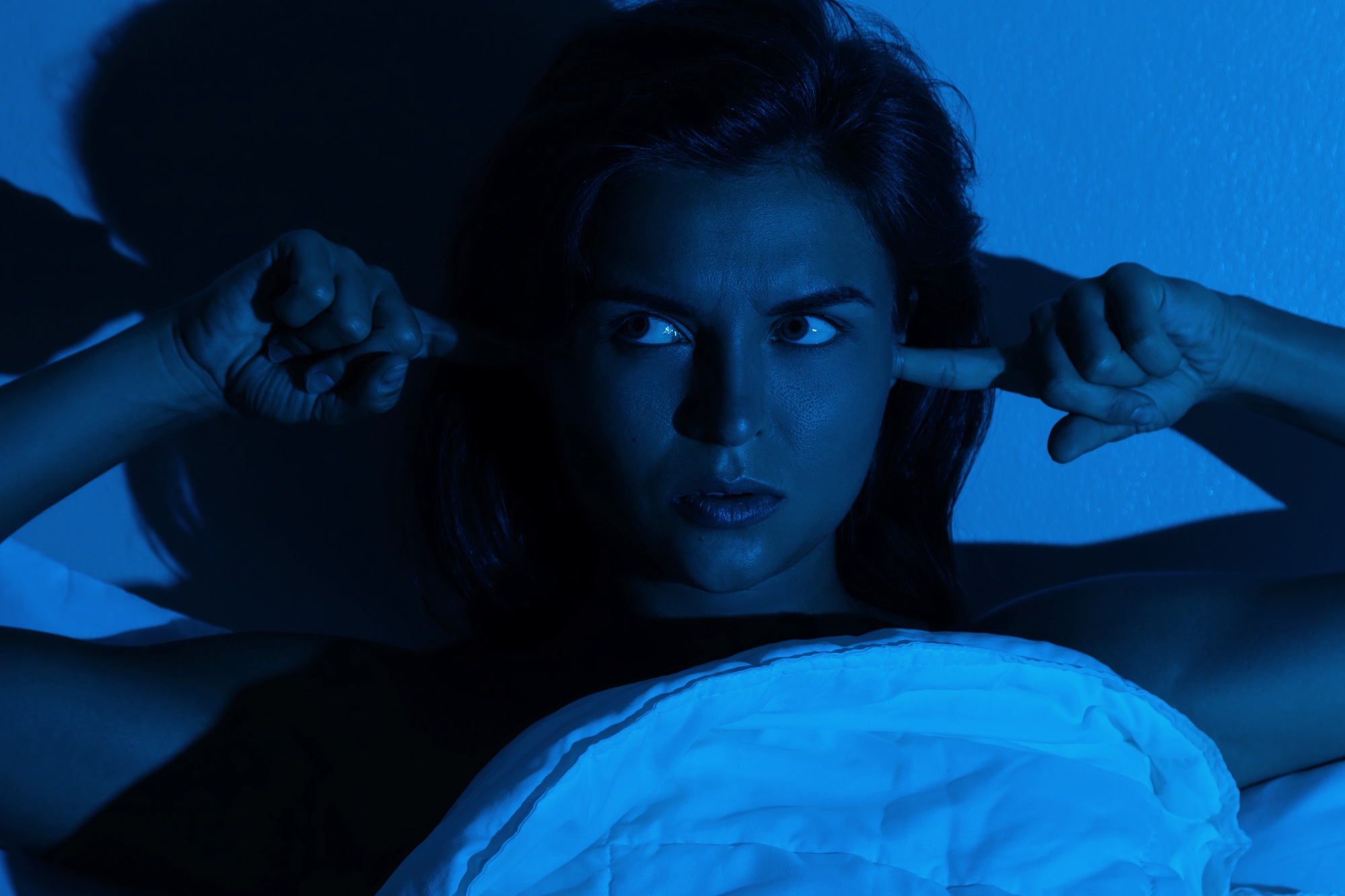 Woman with insomnia because of loud noises
